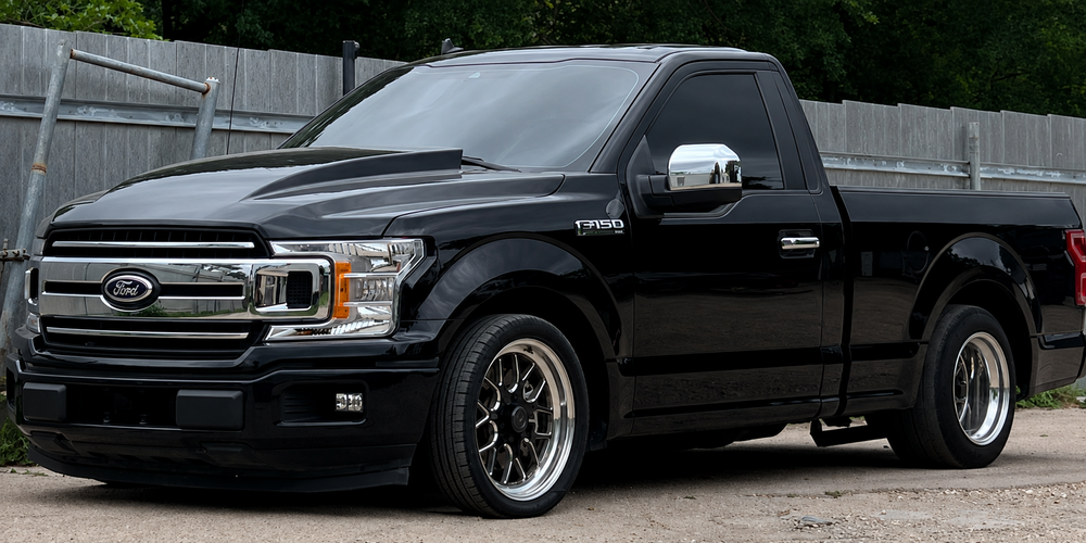 Lowered black Ford F-150 pickup truck