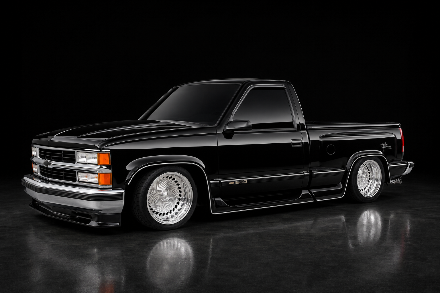 Glossy black lowered OBS Chevrolet truck in a dark studio with floor reflection
